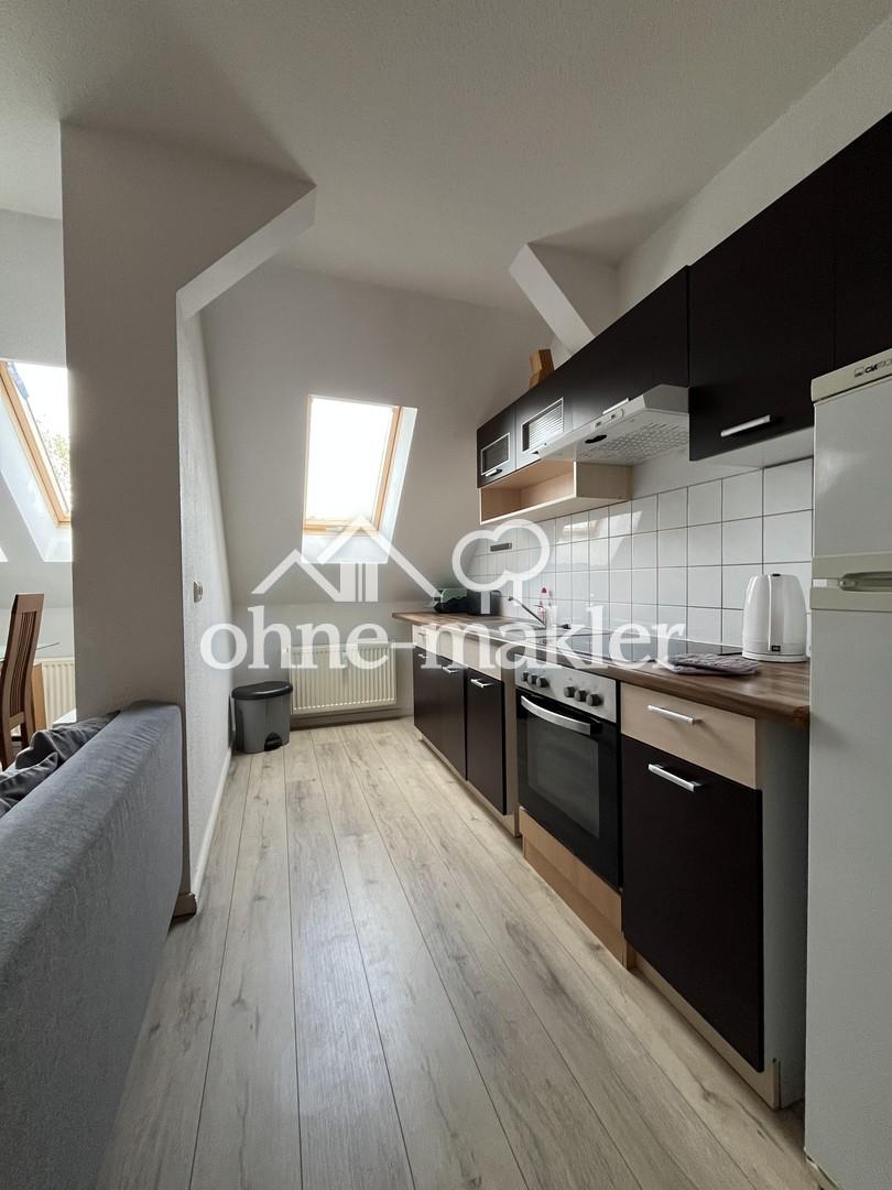 teilmöblierte DG-Wohnung mit EBK - Photo 3