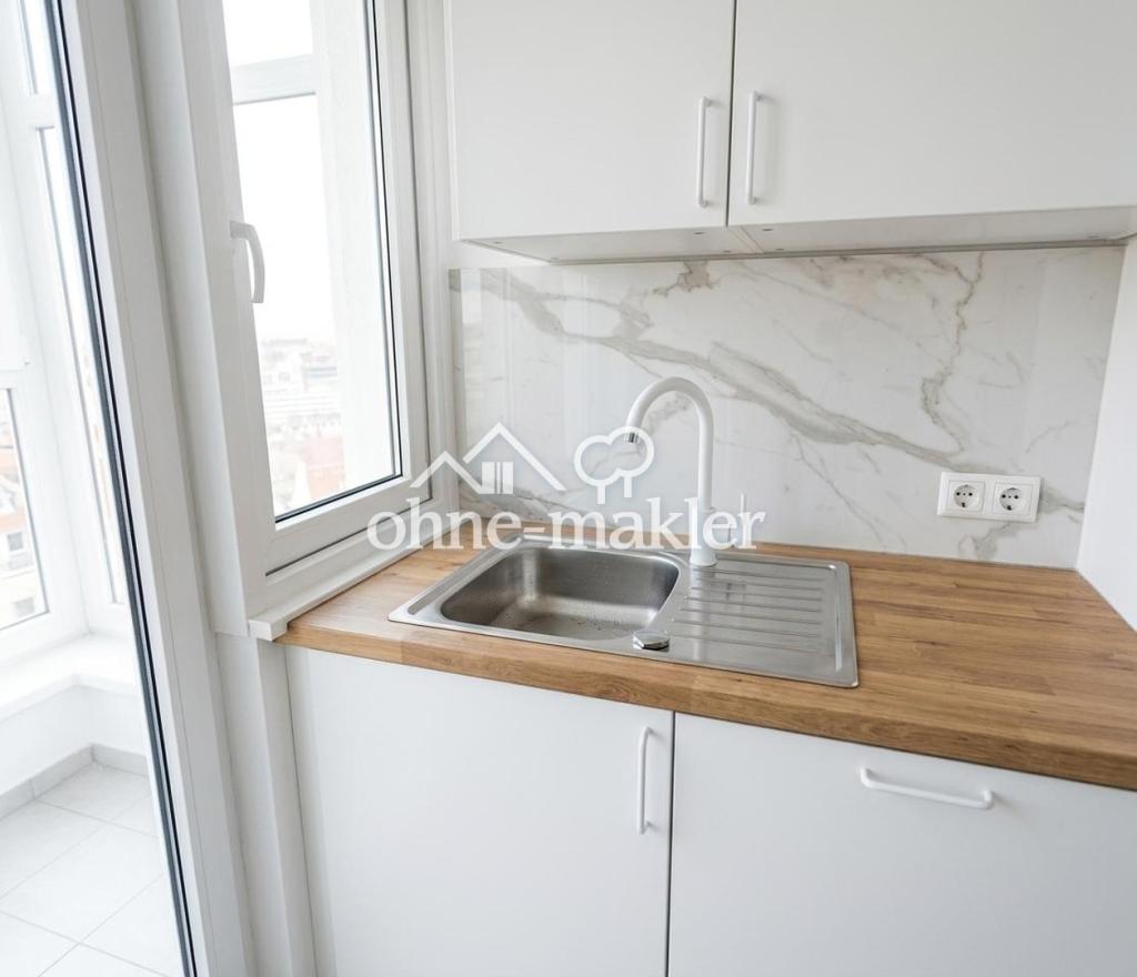 Helle 2-Zimmer-Dachgeschosswohnung mit Balkon, Einbauküche & TG-Stellplatz - Foto 3