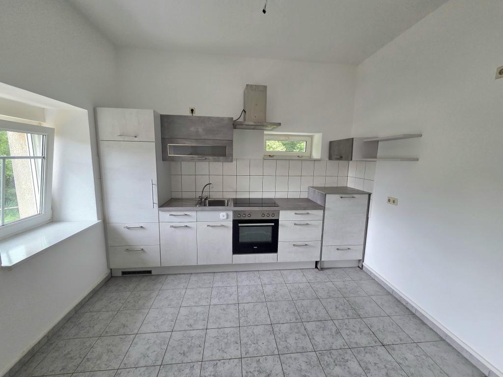 Charmantes 1-Zimmer-Apartment mit Einbauküche und Terrasse im Grünen! - Foto 4