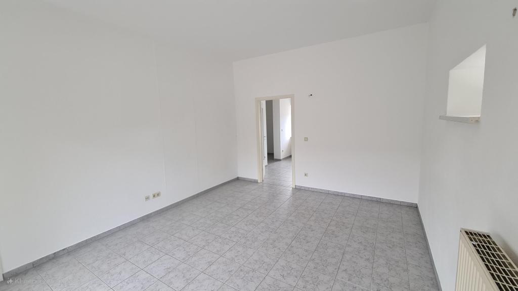 Charmantes 1-Zimmer-Apartment mit Einbauküche und Terrasse im Grünen! - Foto 1