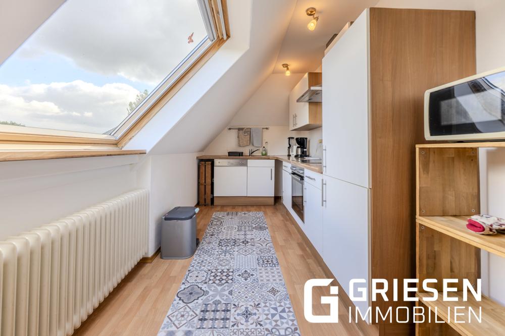 Wohnen mit Freiraum: Großzügige Dachgeschosswohnung mit Balkon & Gartenanteil in zentraler Lage von Haren (Ems) - Foto 5