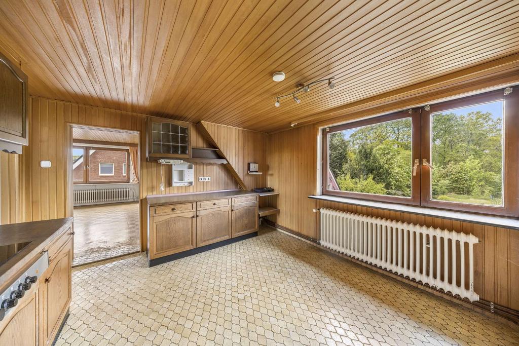 Gemütliche DG-Wohnung in gepflegter Doppelhaushälfte mit Blick ins Grüne - Foto 1