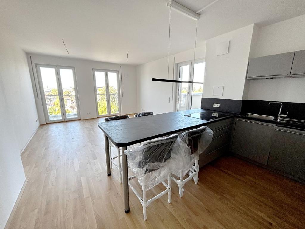 Helligkeit & Eichenholz: Barrierefreie 3-Zimmer-Wohnung mit West-Dachterrasse & Fernblick. - Photo 3