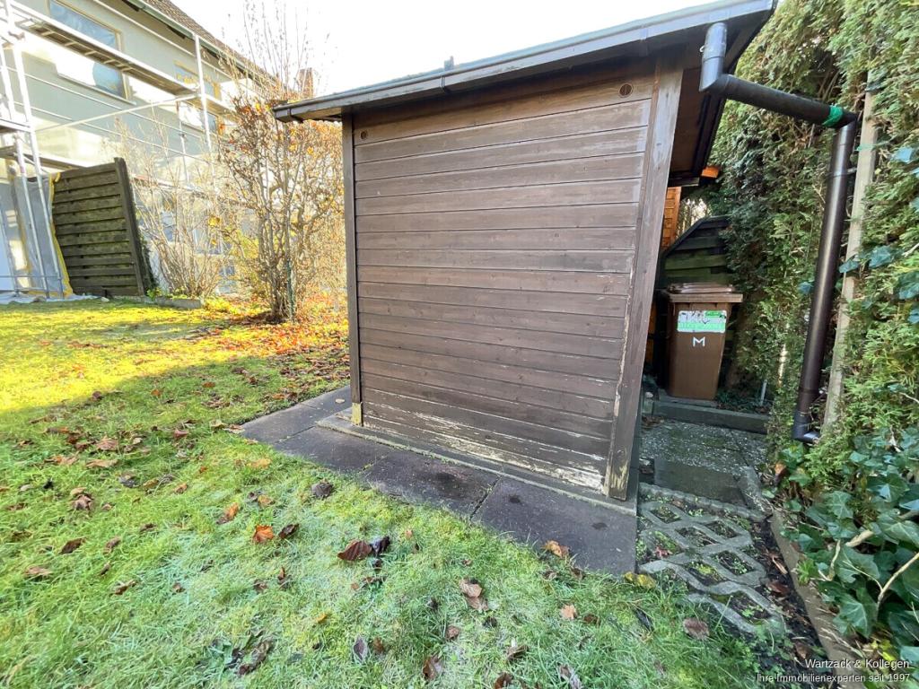 Gartenhaus mit verstecktem Gartenzugang