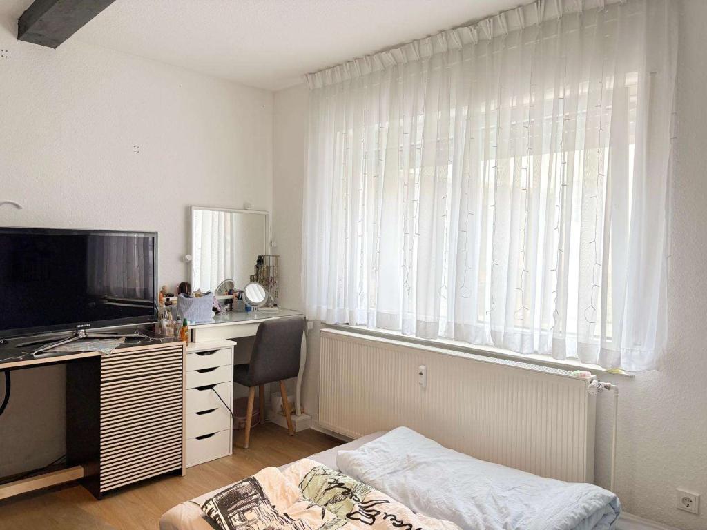 Gepflegtes 1-Zimmer-Apartment mit offenem Wohnkonzept und Einbauküche - Foto 3