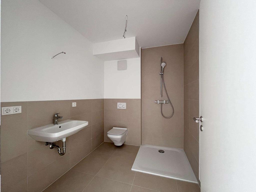 Modernes 1-Zimmer-Apartment mit Balkon und PKW-Stellplatz in Ober-Mörlen - Photo 2