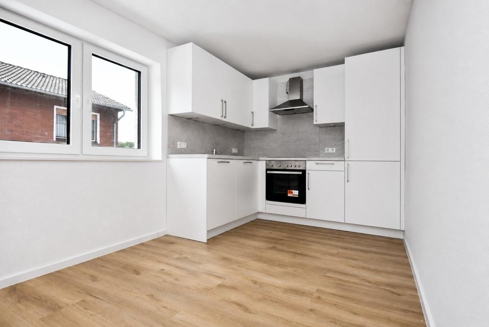 Erstbezug - Neubauwohnung mit Einbauküche, Dachterrasse mit Markise und PKW-Stellplatz in Altenoythe - Foto 2