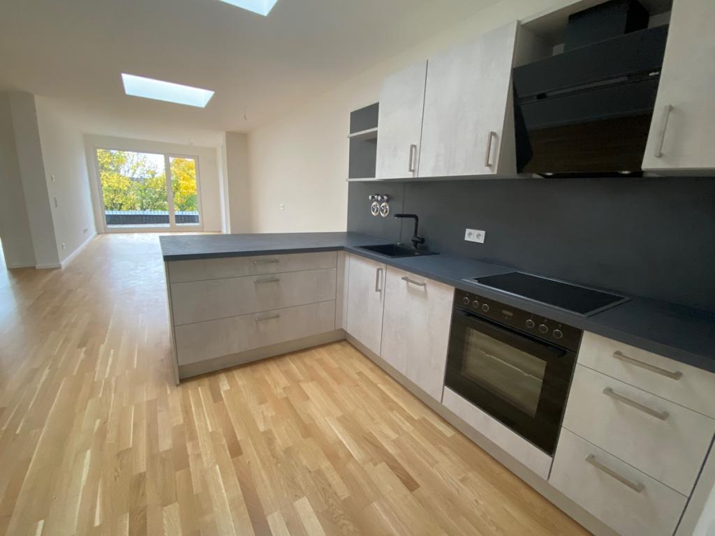 NEUBAU im Erstbezug: 2,5 Zimmer Wohnung mit EBK, Dachterrasse und Tiefgarage - Foto 1