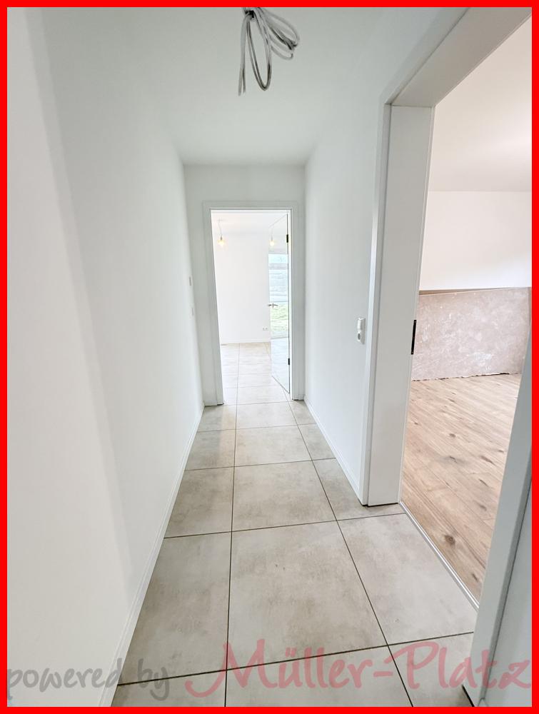 Erstbezug: Barrierearme Erdgeschosswohnung mit Terrasse und kostenfreier Einbauküche! - Photo 2