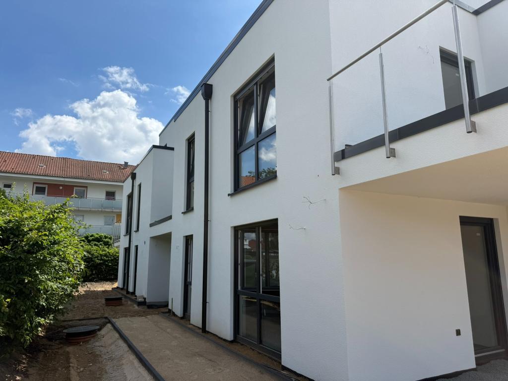 Moderne Neubau-Erdgeschosswohnung mit Terrasse und eigenem Gartenanteil - Foto 4