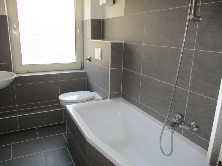 Komfortabel wohnen im Erdgeschoss mit modernem Bad zum Wohlfühlen - Foto 1