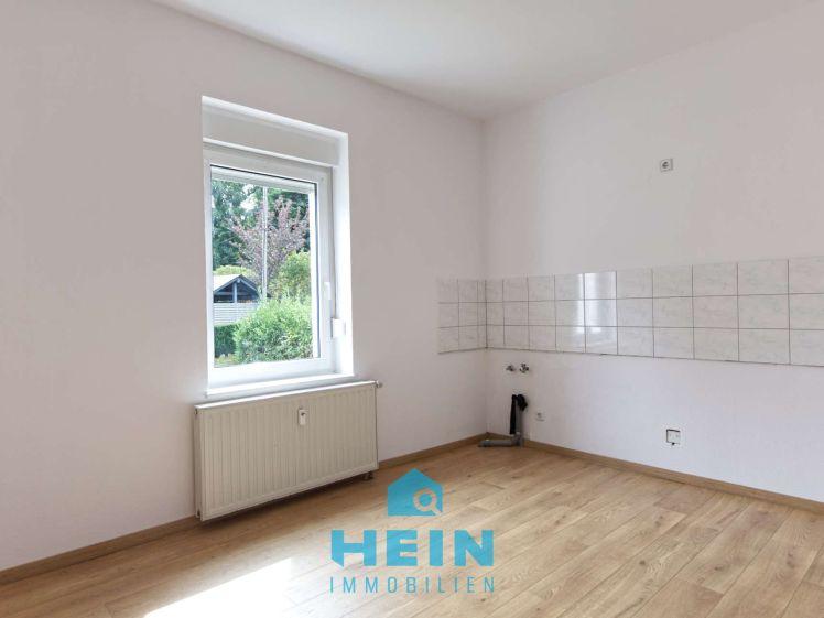 Freundliche 2-Raumwohnung mit Pkw-Stellplatz und eigenen Gartenanteil - Foto 1