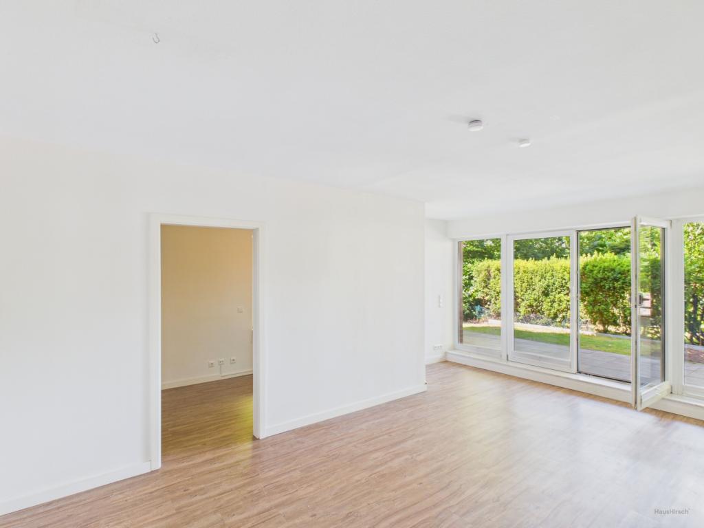 Gehobene Ausstattung trifft Natur: Erdgeschosswohnung mit Garten in bester Lage - Foto 1