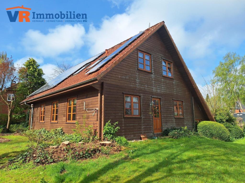 Holzblockhaus mit Einliegerwohnung